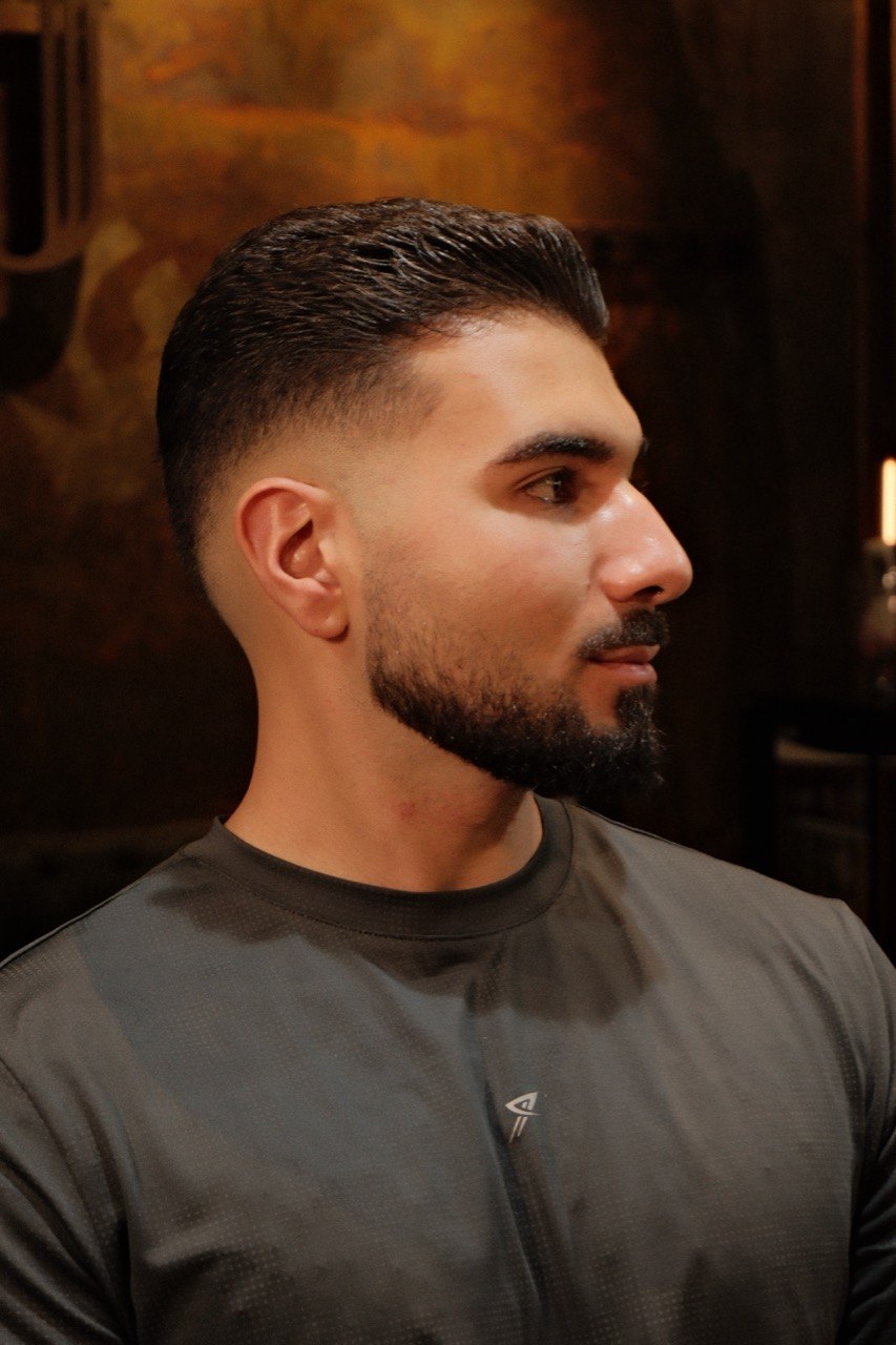 A classic side part, cut at Crew Barbers