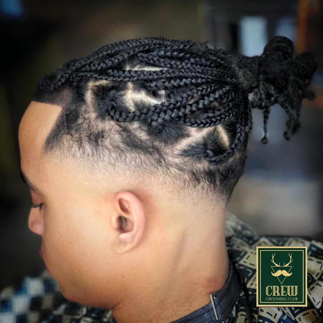 Cornrow braids with a sharp hairline shape-up