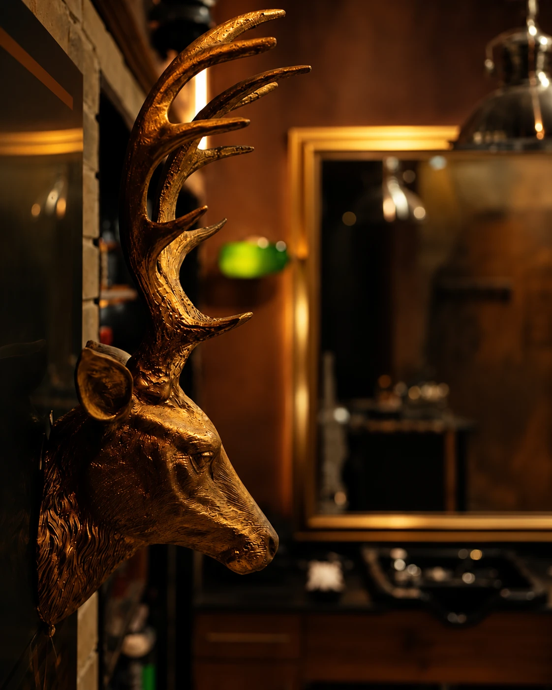 The gold deer-head mount inside Crew Barbers Brentford