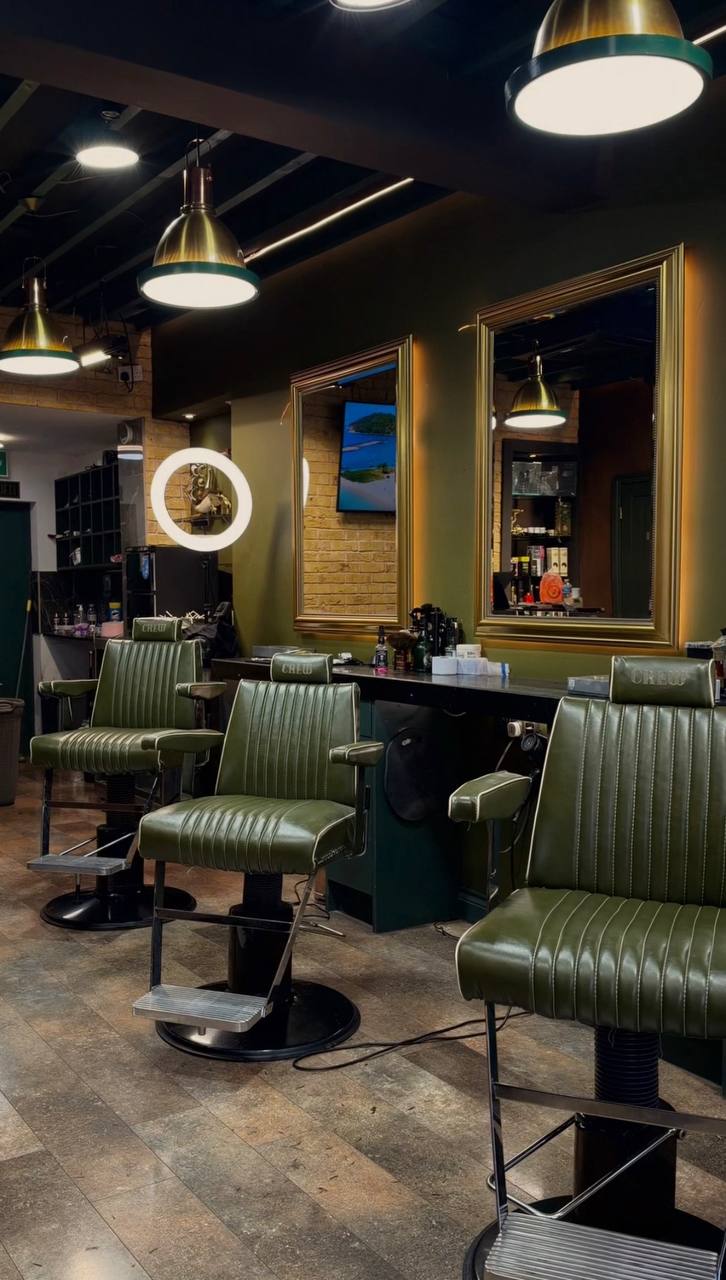 The chairs and mirrors inside Crew Barbers Isleworth