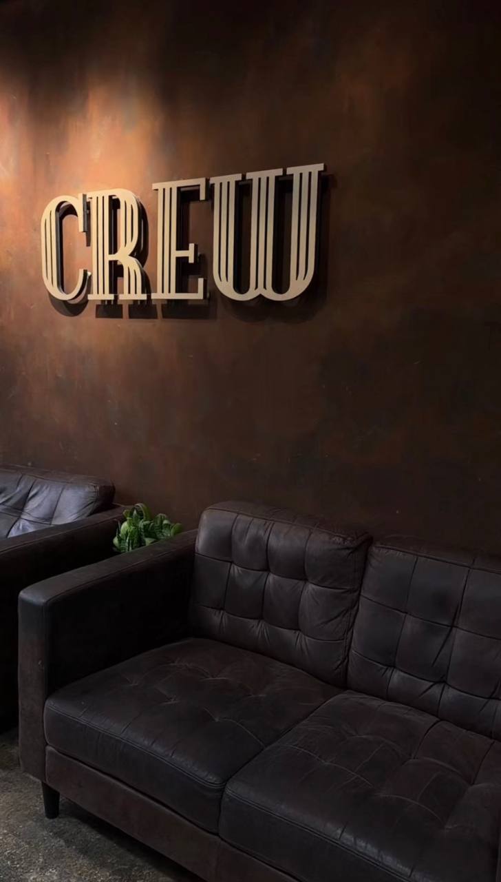 The Crew sign in the waiting area at Isleworth